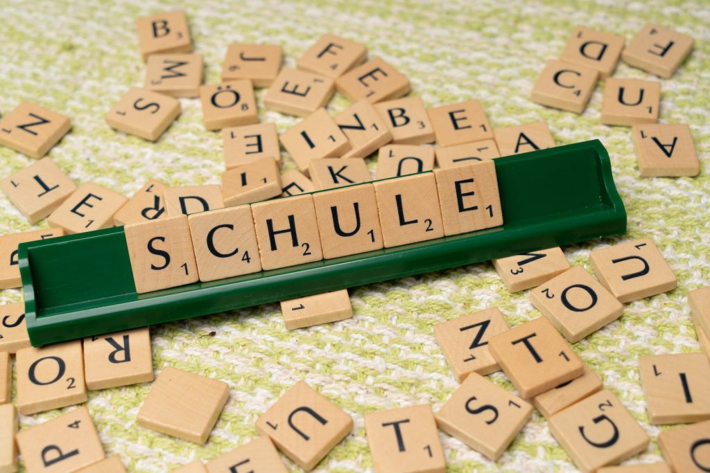 scrabble tiles with the word schule written on them